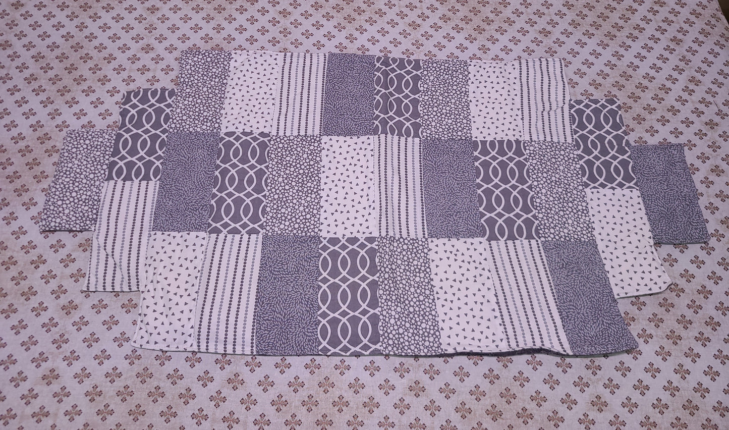 Quilted gray and white table runner